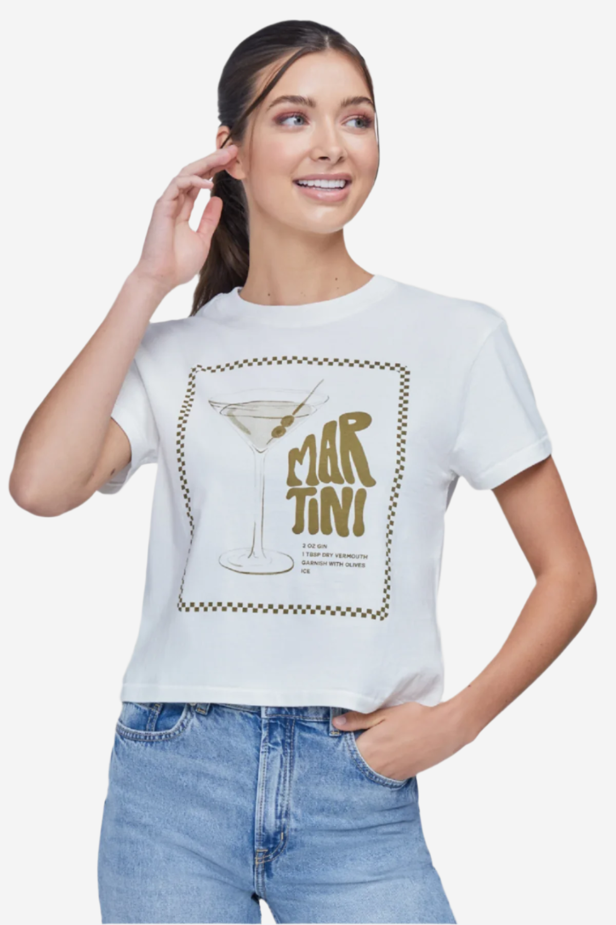 A woman wearing a white crop top with a martini glass graphic and text that includes &