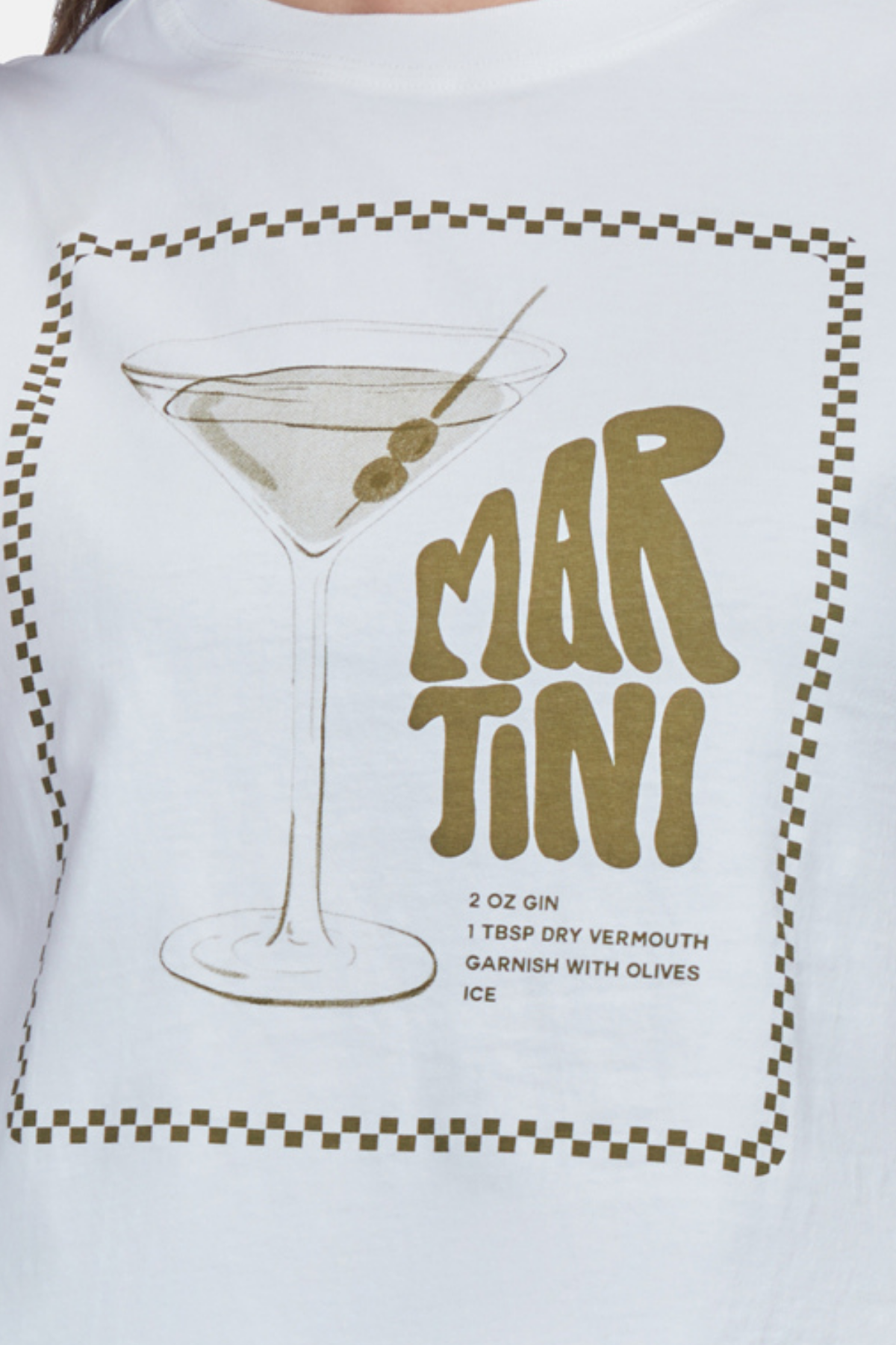 A woman wearing a white crop top with a martini glass graphic and text that includes &