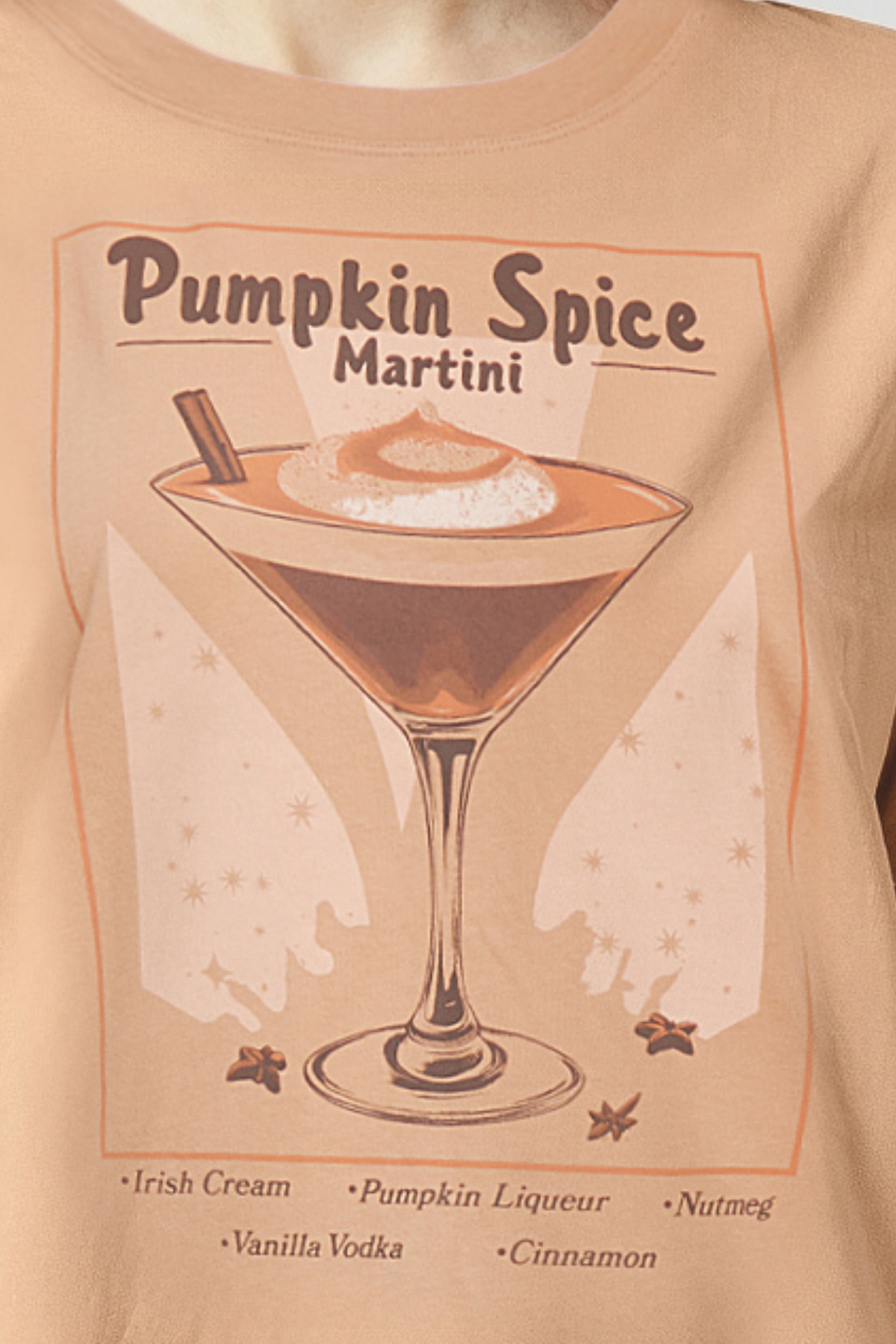 Close up of tan orange T-shirt with &