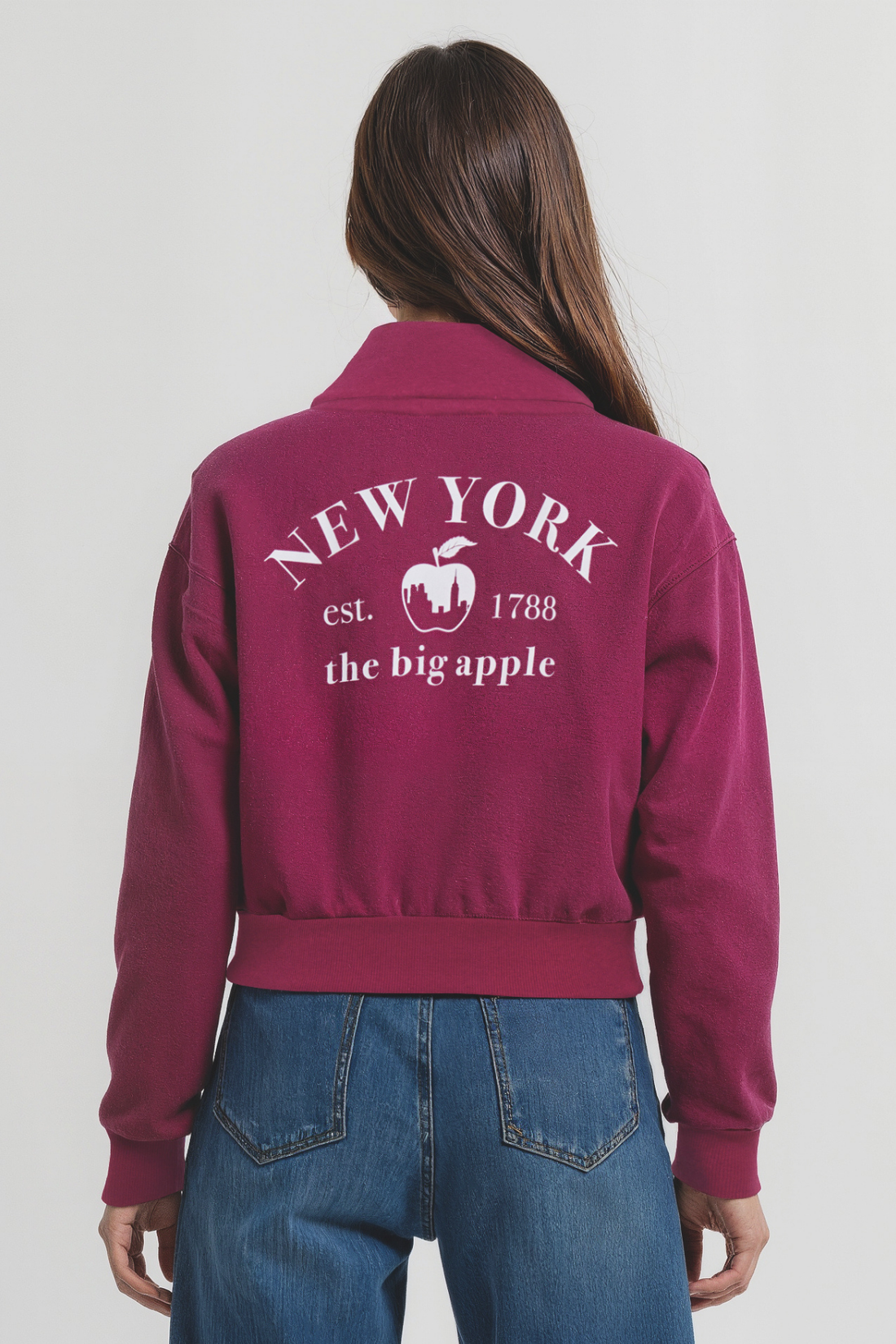 Back view of woman wearing a maroon jacket with &