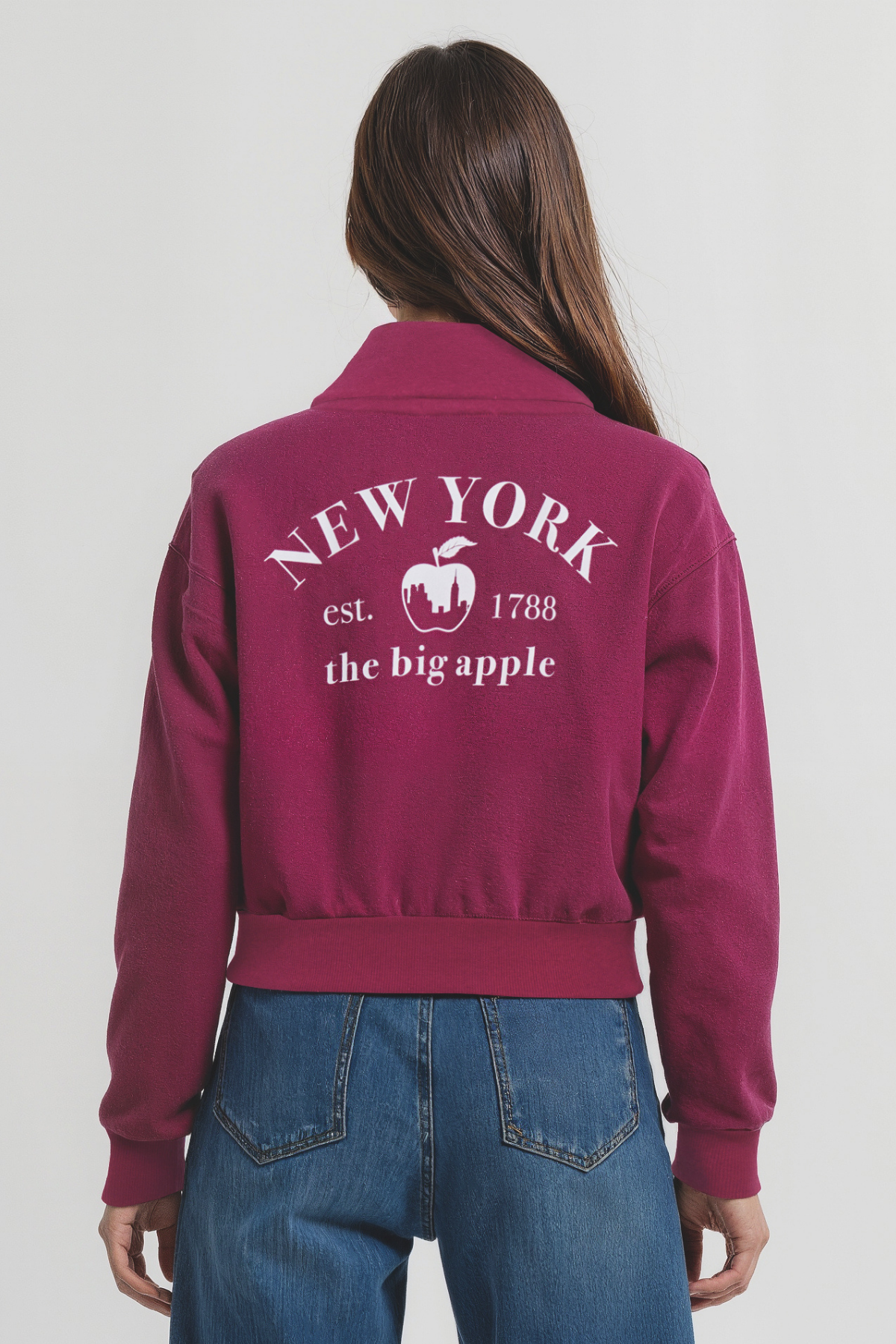 Back view of woman wearing a maroon jacket with &