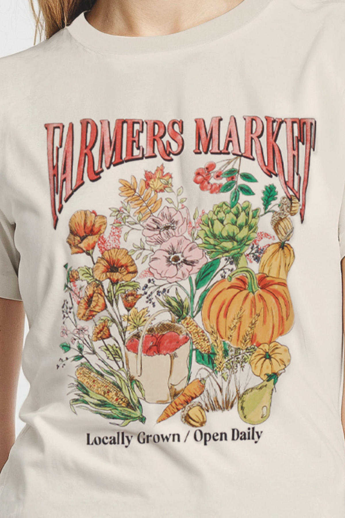 Close up of beige t-shirt with &