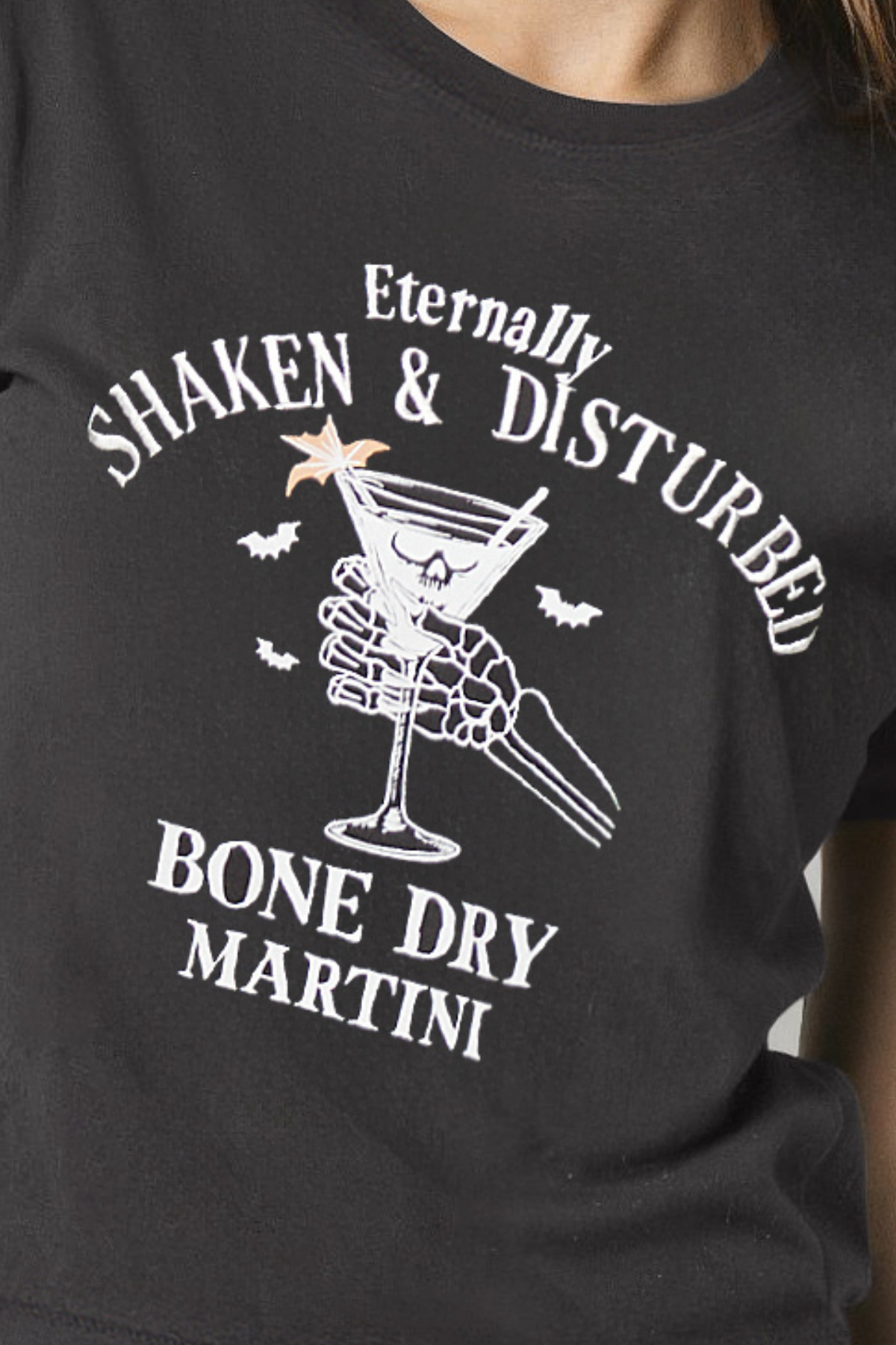 Black t-shirt with white graphic design of a martini glass and text &
