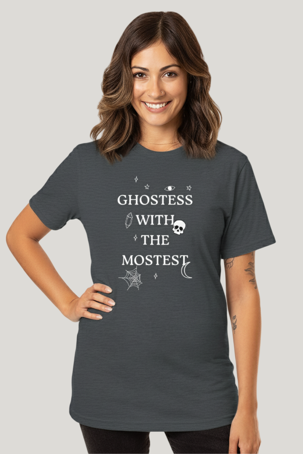 A woman wearing a gray t-shirt with the text &