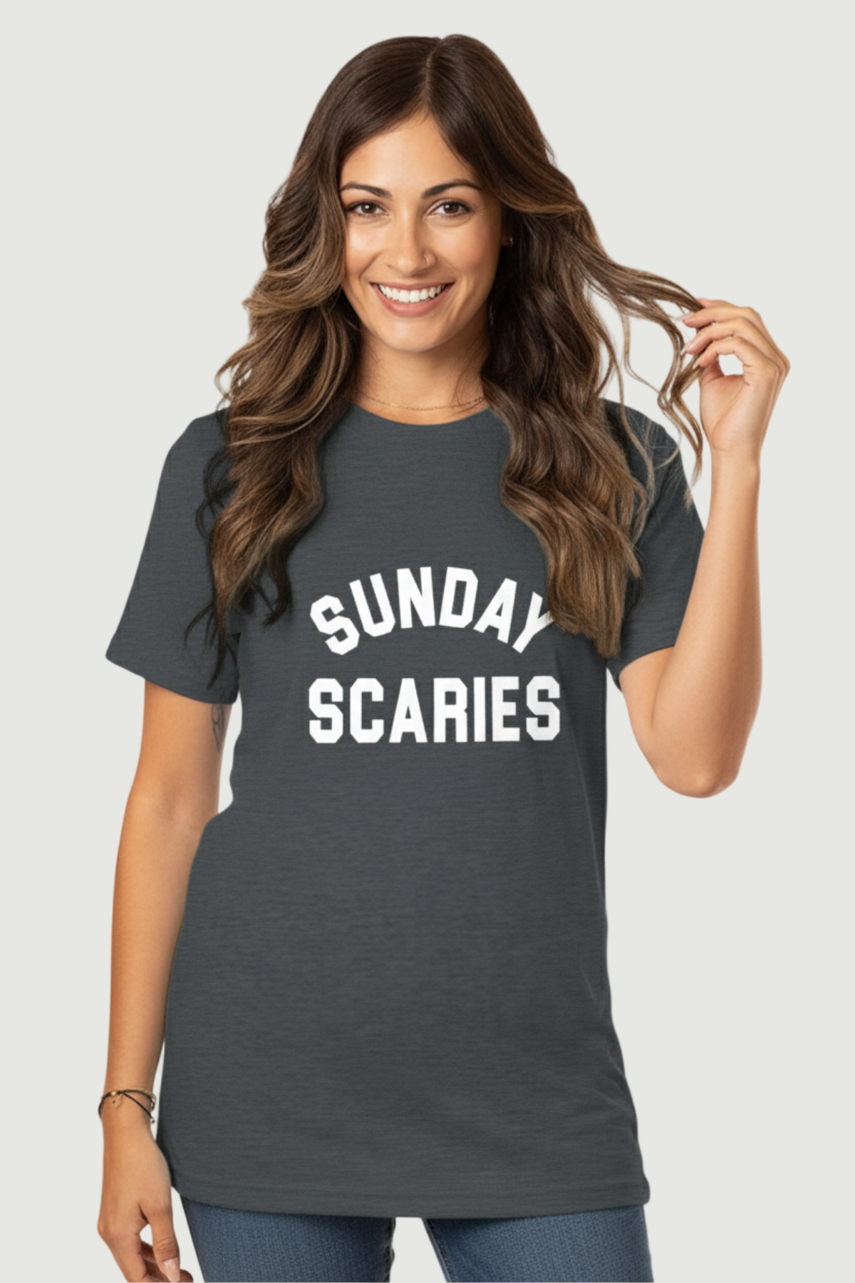 A woman wearing a gray t-shirt with &