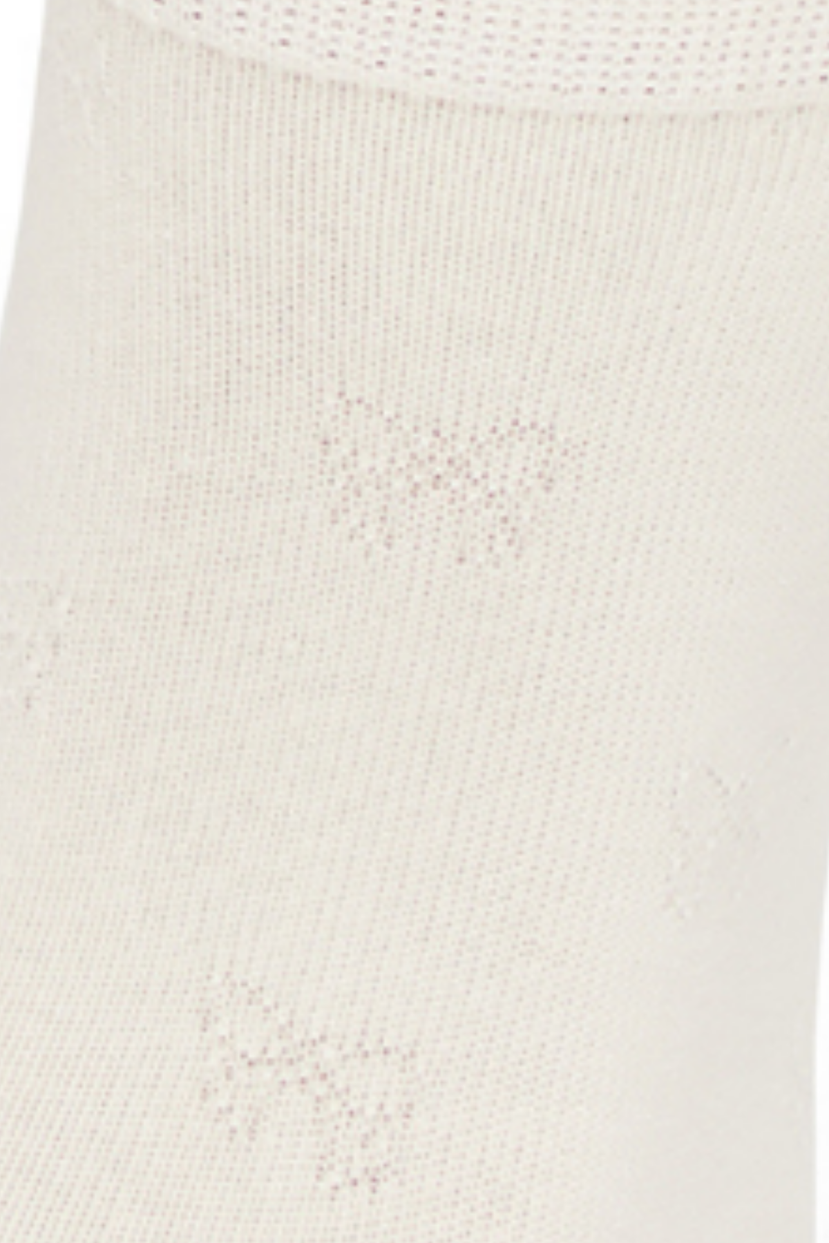 Close-up of a white sock with embossed bow textured print fabric.