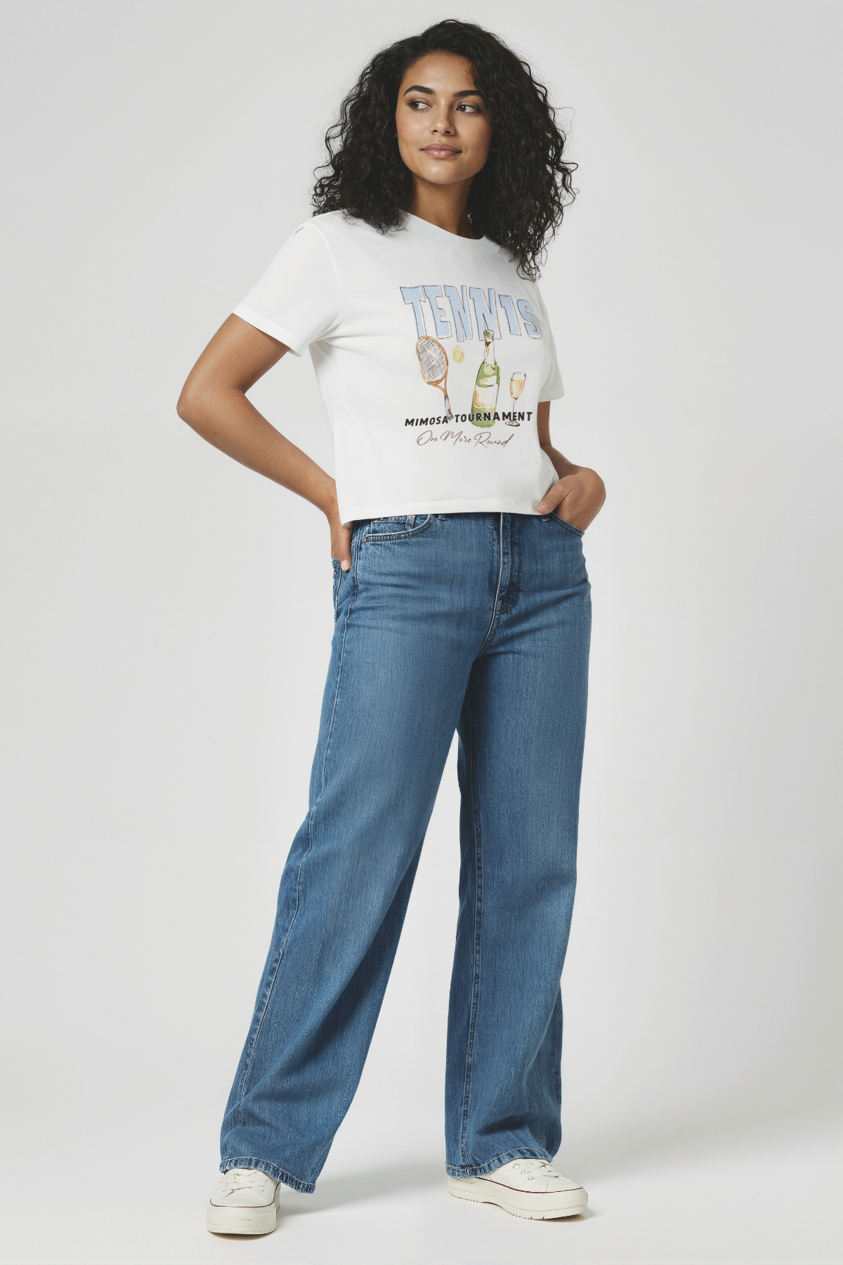 Woman wearing a light blue t-shirt with &