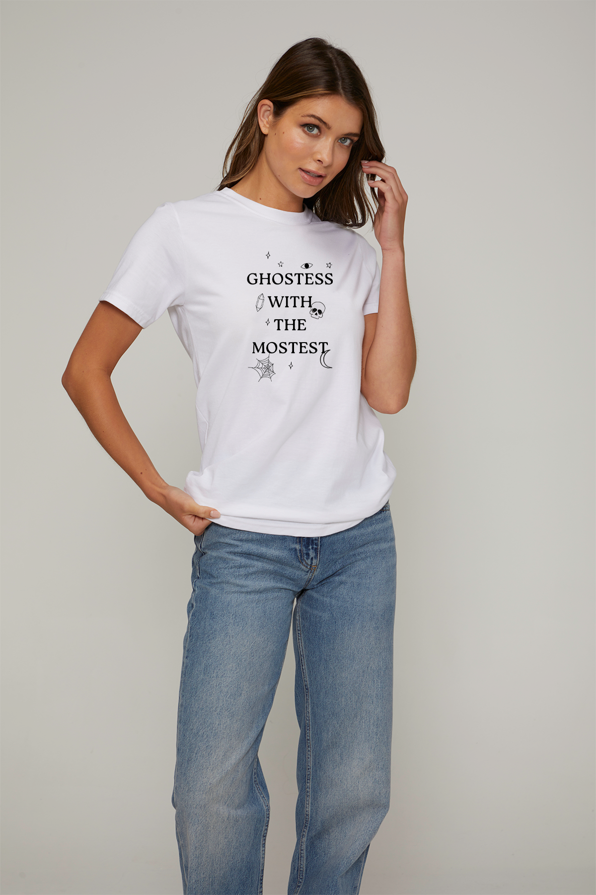 A woman wearing a white t-shirt with the black text &
