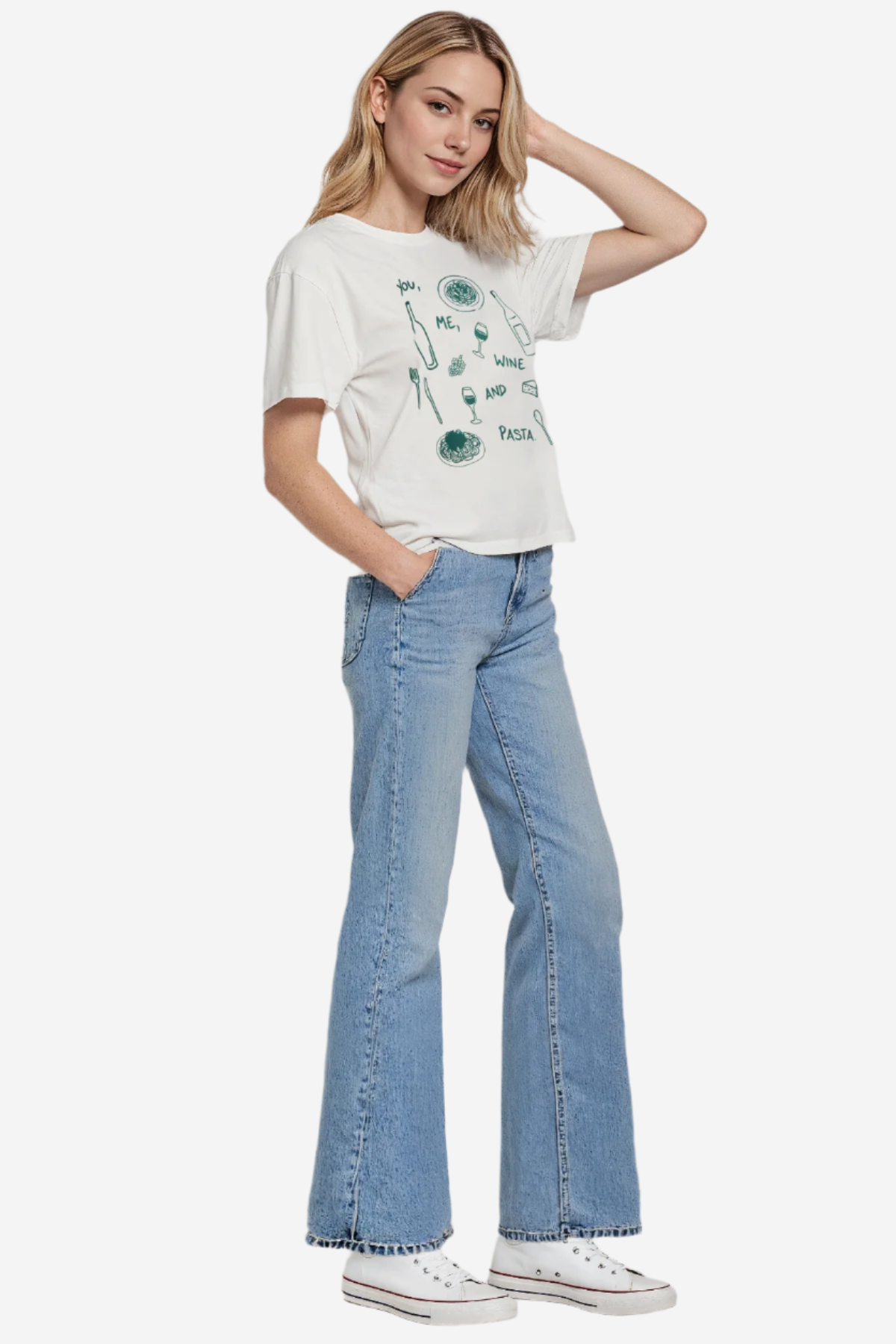 This is an alternate side image of the model wearing the pasta shirt. The model is posing with blue jeans and white shoes.