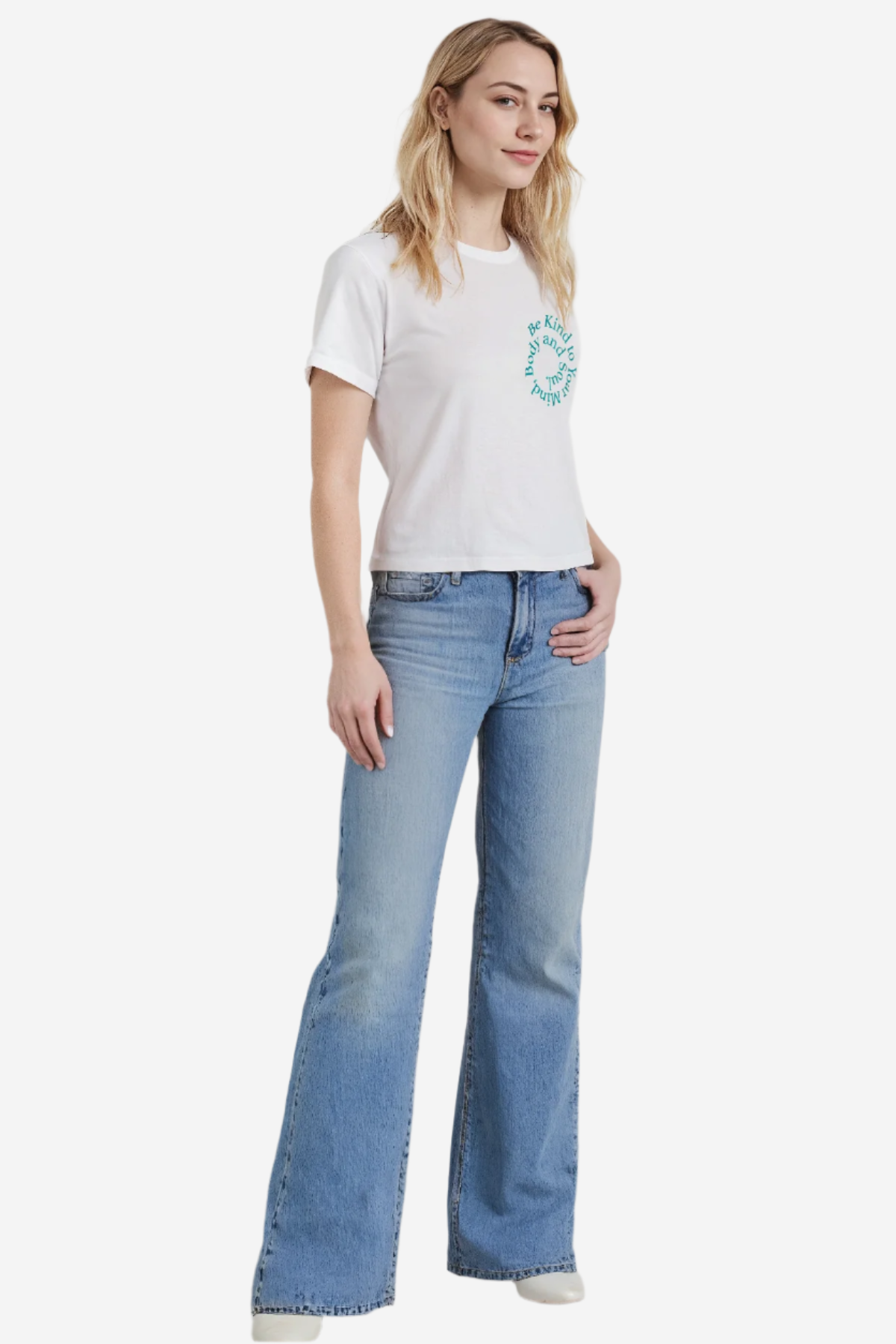 A woman wearing a white crewneck t-shirt with the phrase &