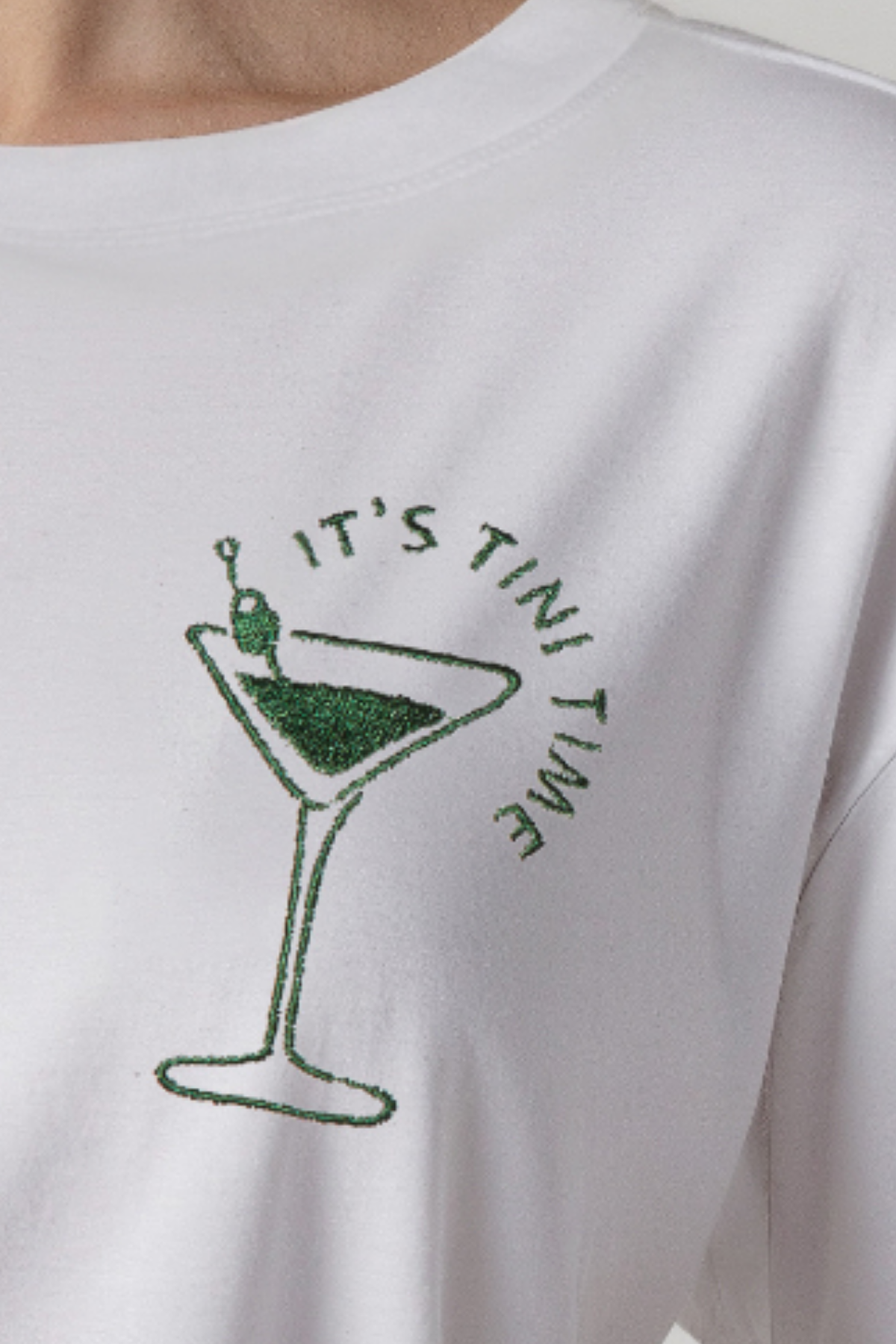 Close up of a white crewneck t-shirt with &