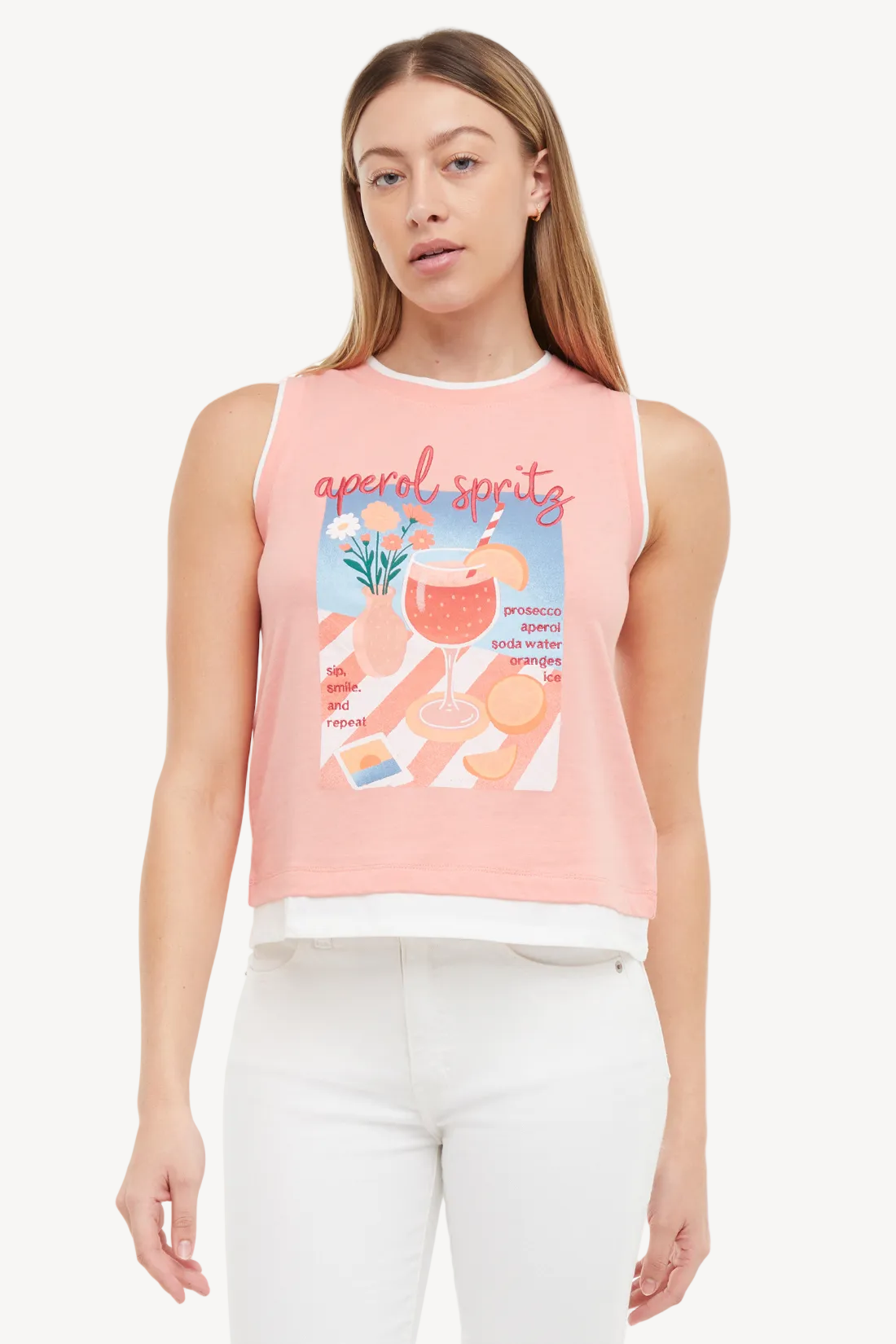 Woman wearing a pink sleeveless top with graphics and text on a white background