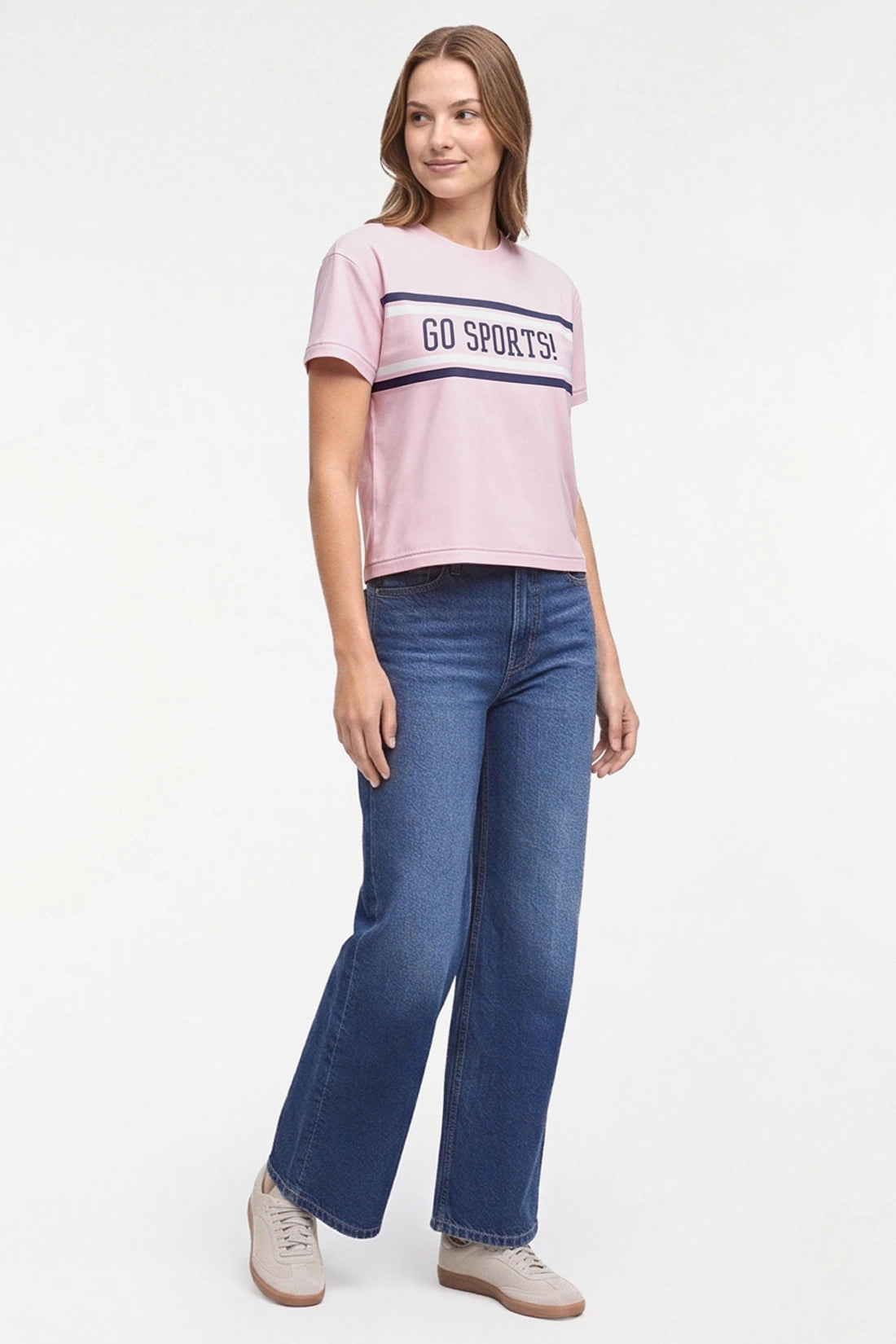 A woman modeling a light pink short-sleeve t-shirt with &