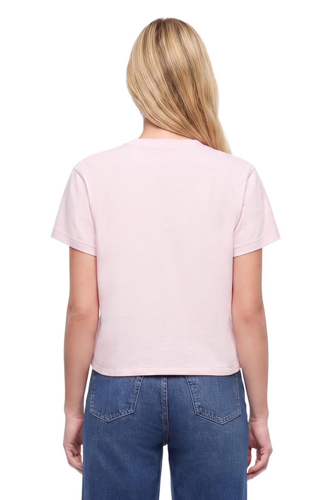 Back view of woman wearing a light pink t-shirt and blue jeans on a white background.