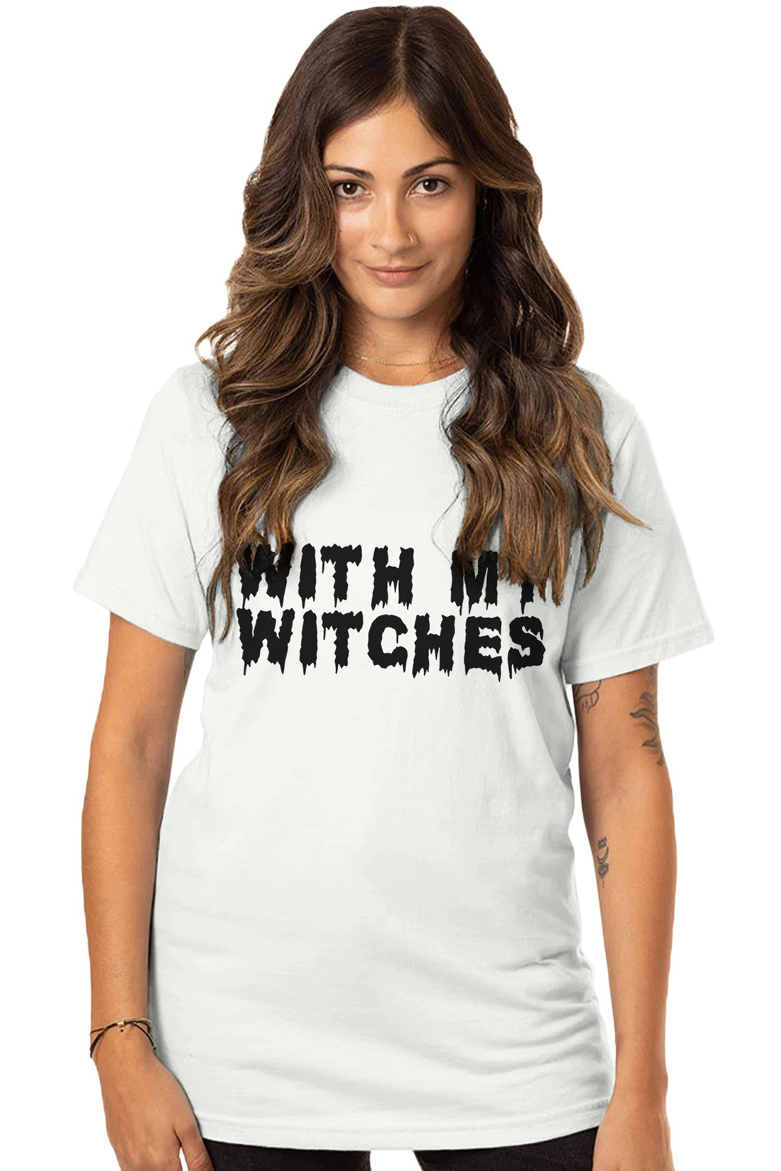 Model wearing a white crew neck tee shirt with the text "With My Witches" written across the chest. The text is written with a font style that looks like the ink is bleeding down from each letter.