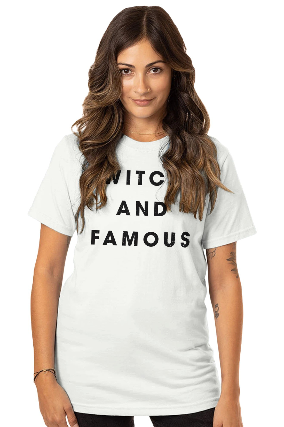 A woman wearing a classic white t-shirt with the text &