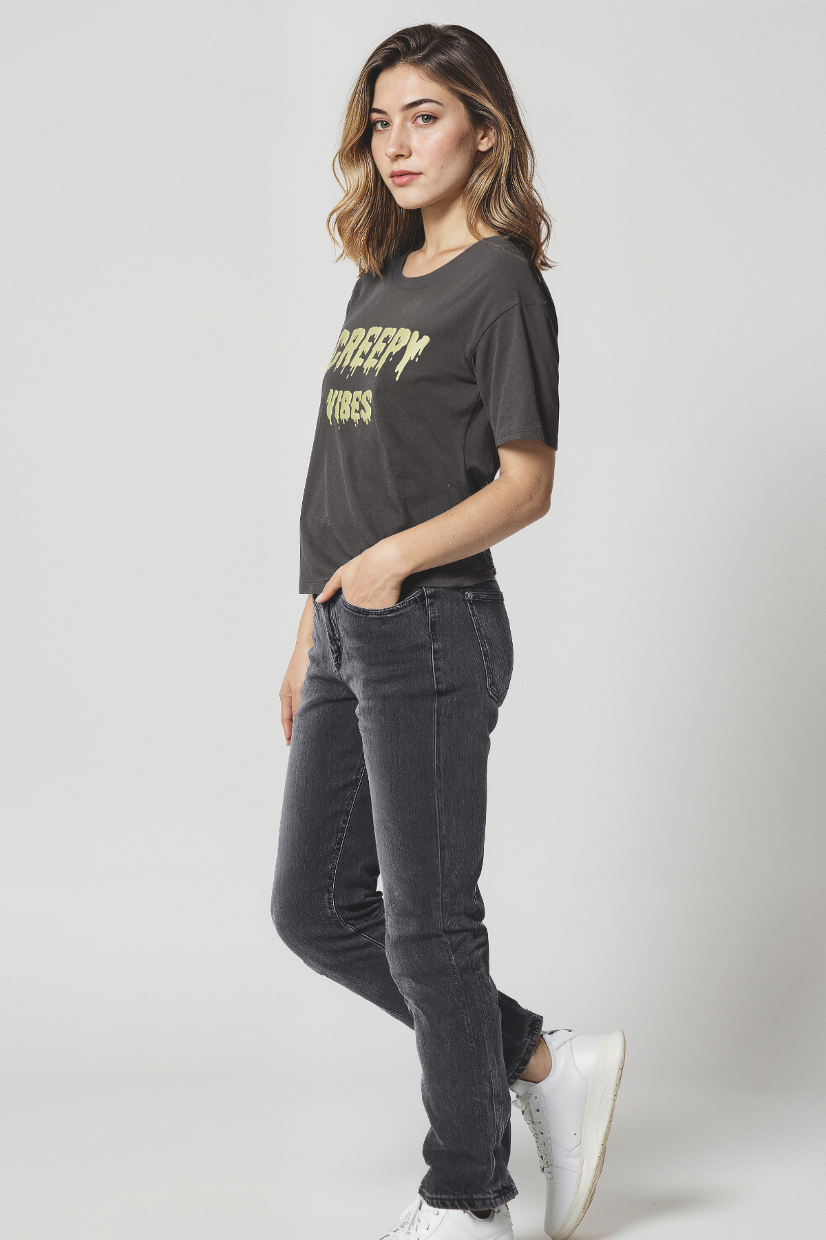 Woman wearing a black t-shirt with &