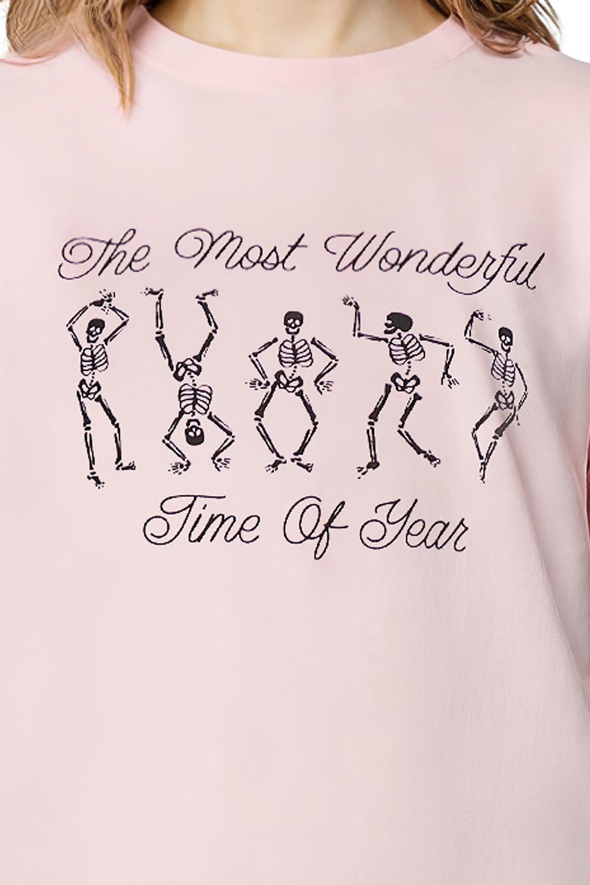 Close up of pink t-shirt with skeleton dancing design and text &