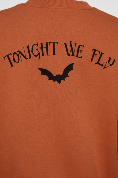 Close up of back orange sweatshirt with &