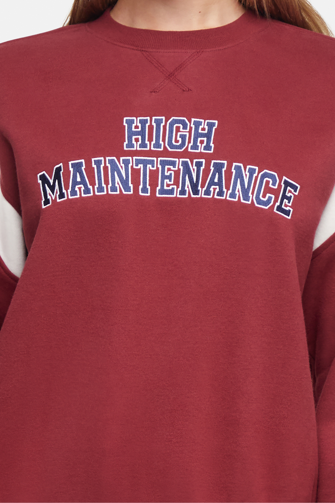 Close up of maroon sweatshirt with &