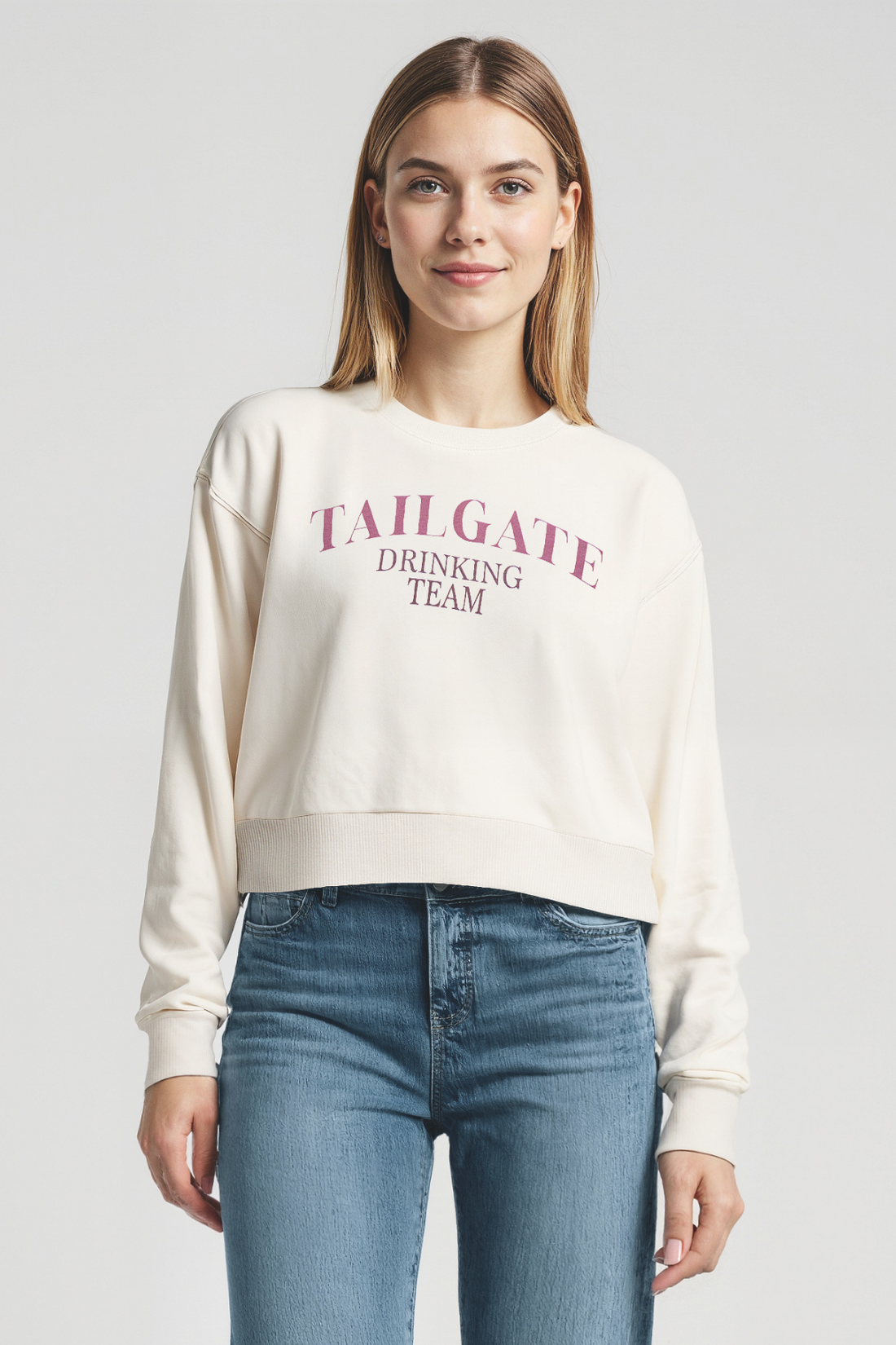 Woman wearing a white sweatshirt with &