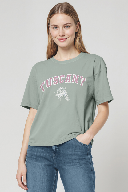 Woman wearing a green t-shirt with &