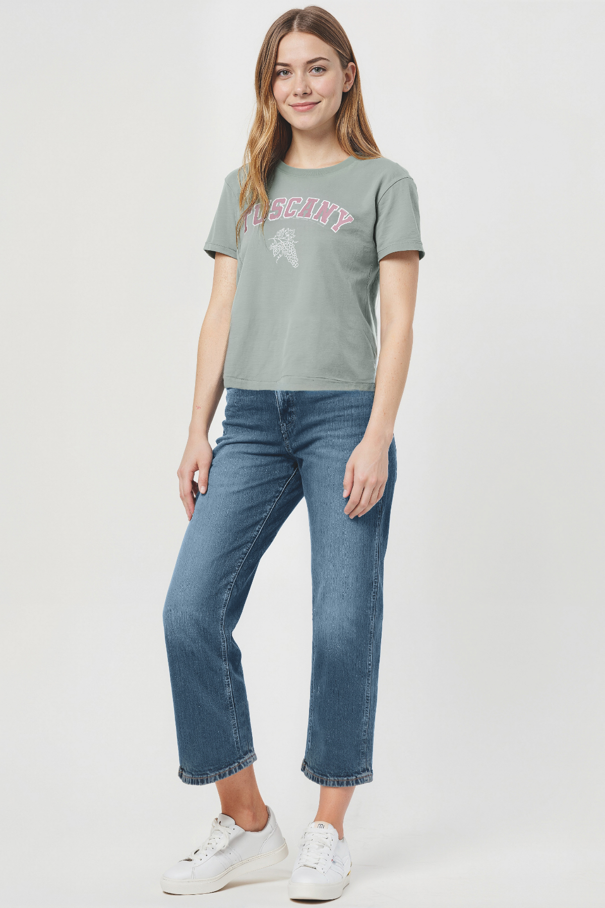Woman wearing a green t-shirt with &