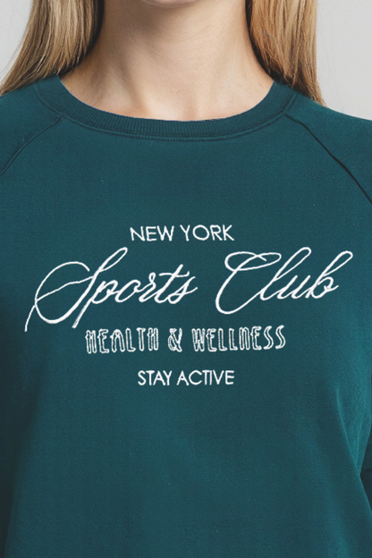 Close up of teal sweatshirt with &