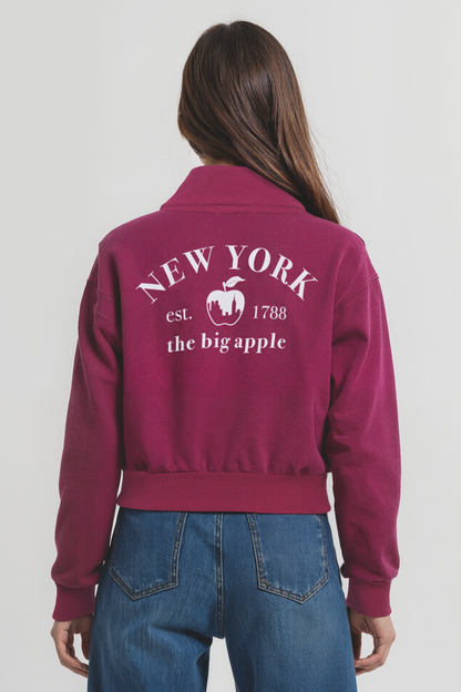 Back view of woman wearing a maroon jacket with &