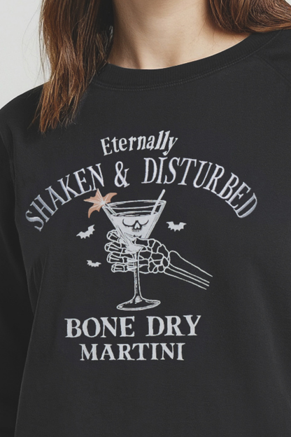 Black t-shirt with white graphic design of a skeleton holding a martini glass and text &