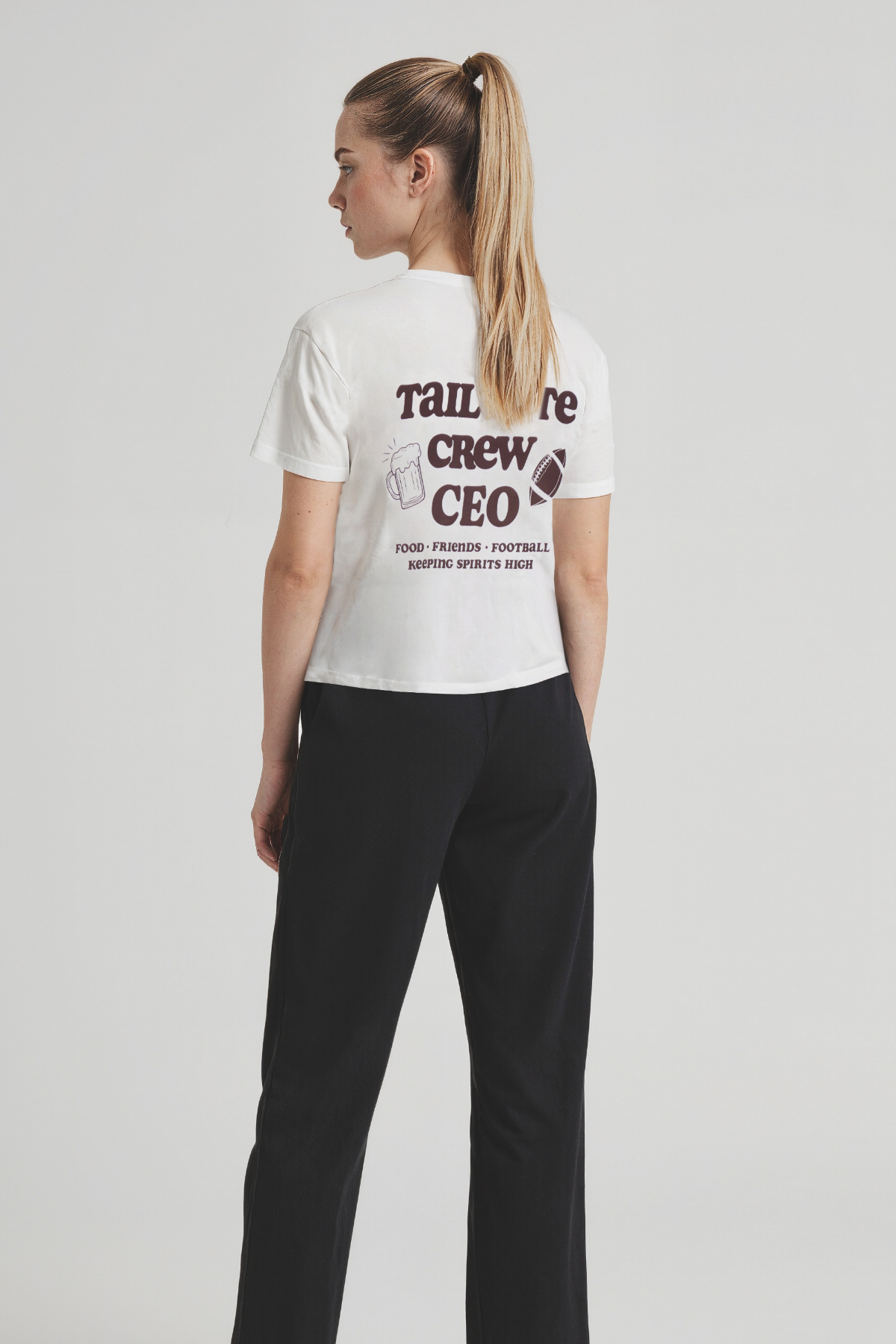 Woman wearing a white t-shirt with &
