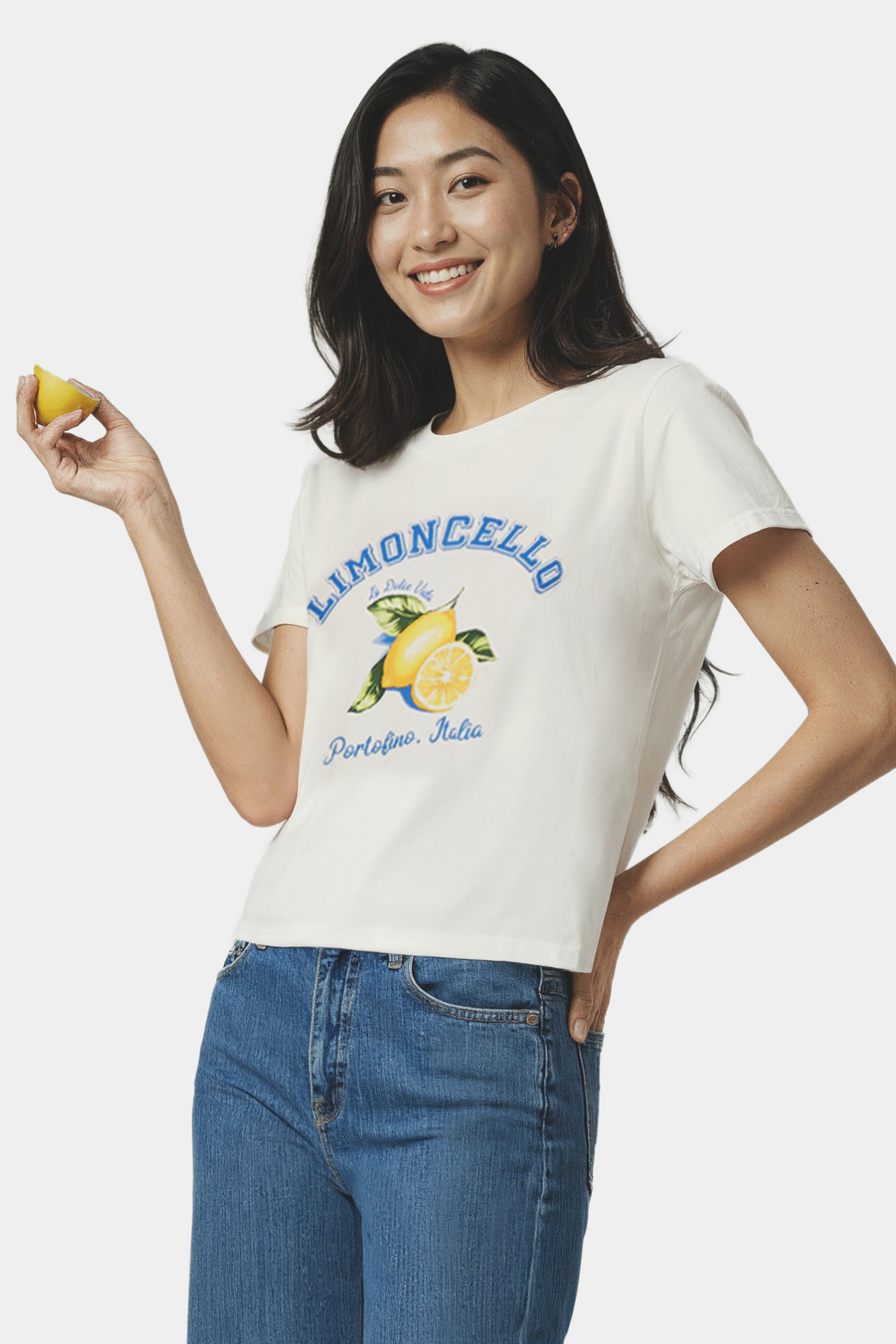 Woman wearing a white t-shirt with lemon graphic and &