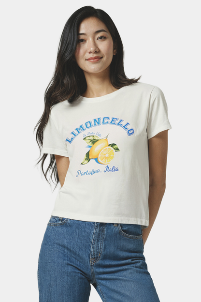 Woman wearing a white t-shirt with lemon graphic and &