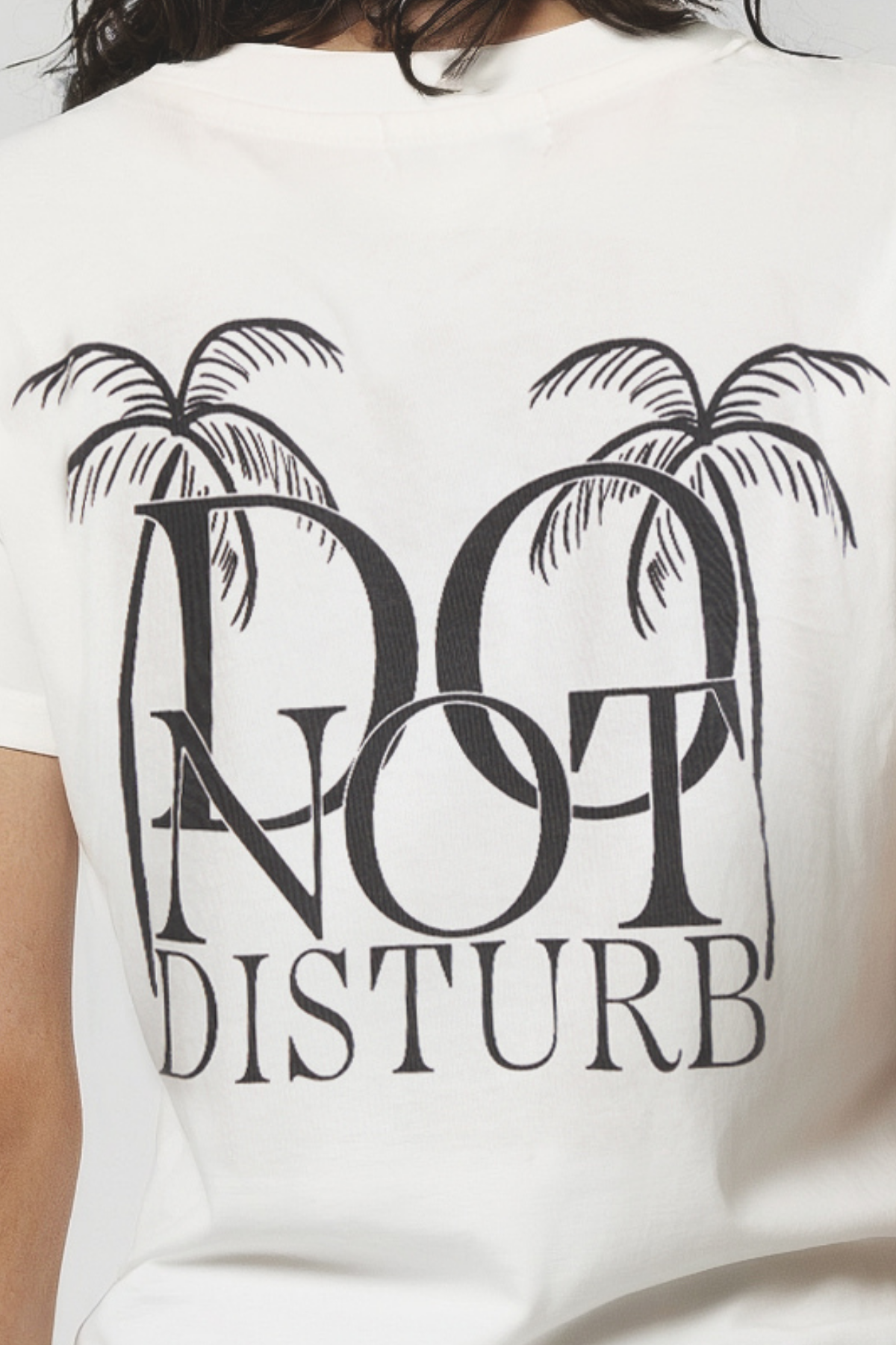 Close up of woman wearing white t-shirt with &