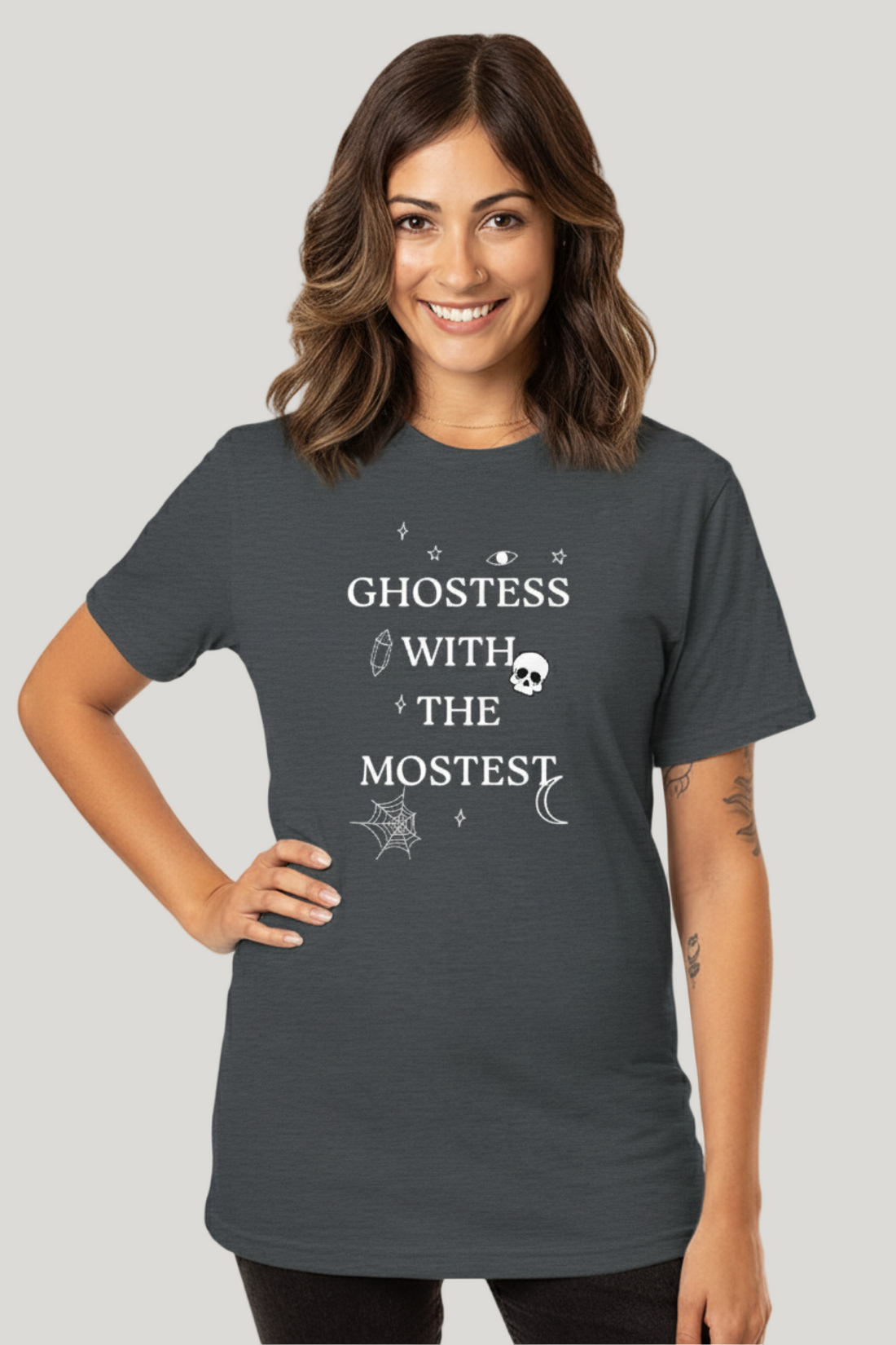 A woman wearing a gray t-shirt with the text &