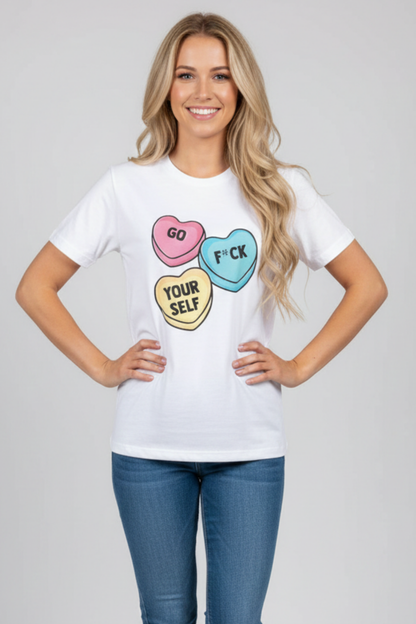 Woman wearing a white crew neck t-shirt with graphic candy hearts and "Go F*ck Yourself" text printed on the front.