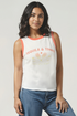 Woman wearing a white tank top with &