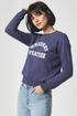 Woman wearing a navy sweatshirt with &