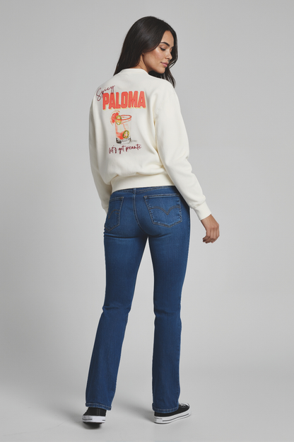 Woman wearing a white sweatshirt with &