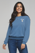 Woman wearing a blue sweatshirt with a with &