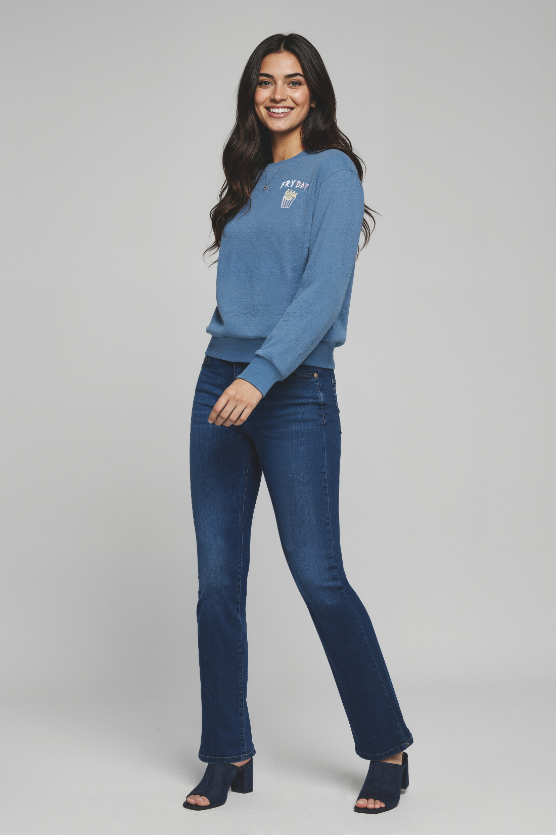 Woman wearing a blue sweater with with &
