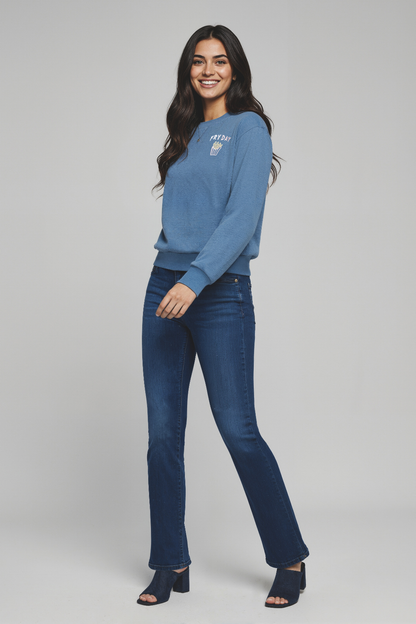Woman wearing a blue sweater with with &