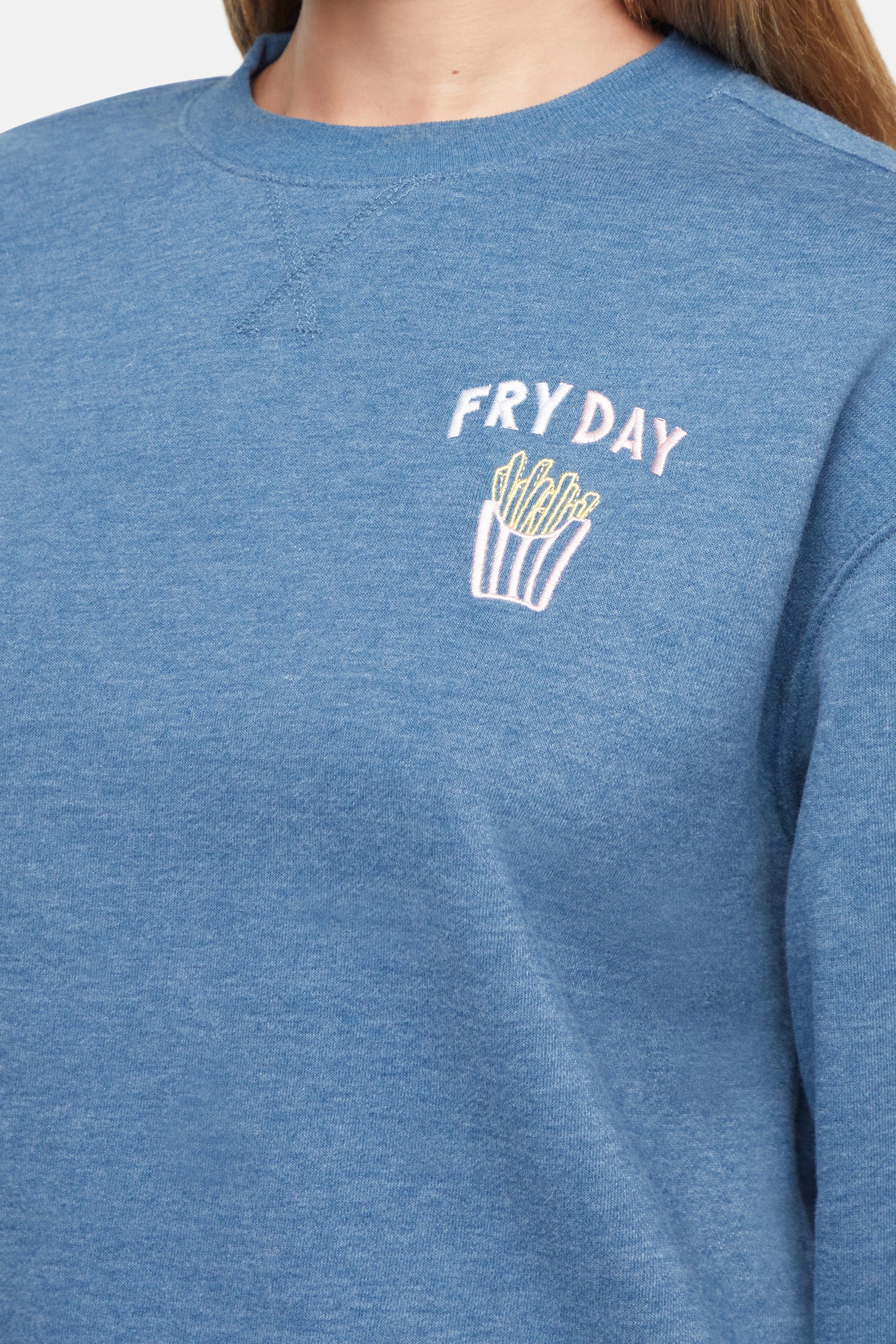 Close up of blue sweatshirt with &