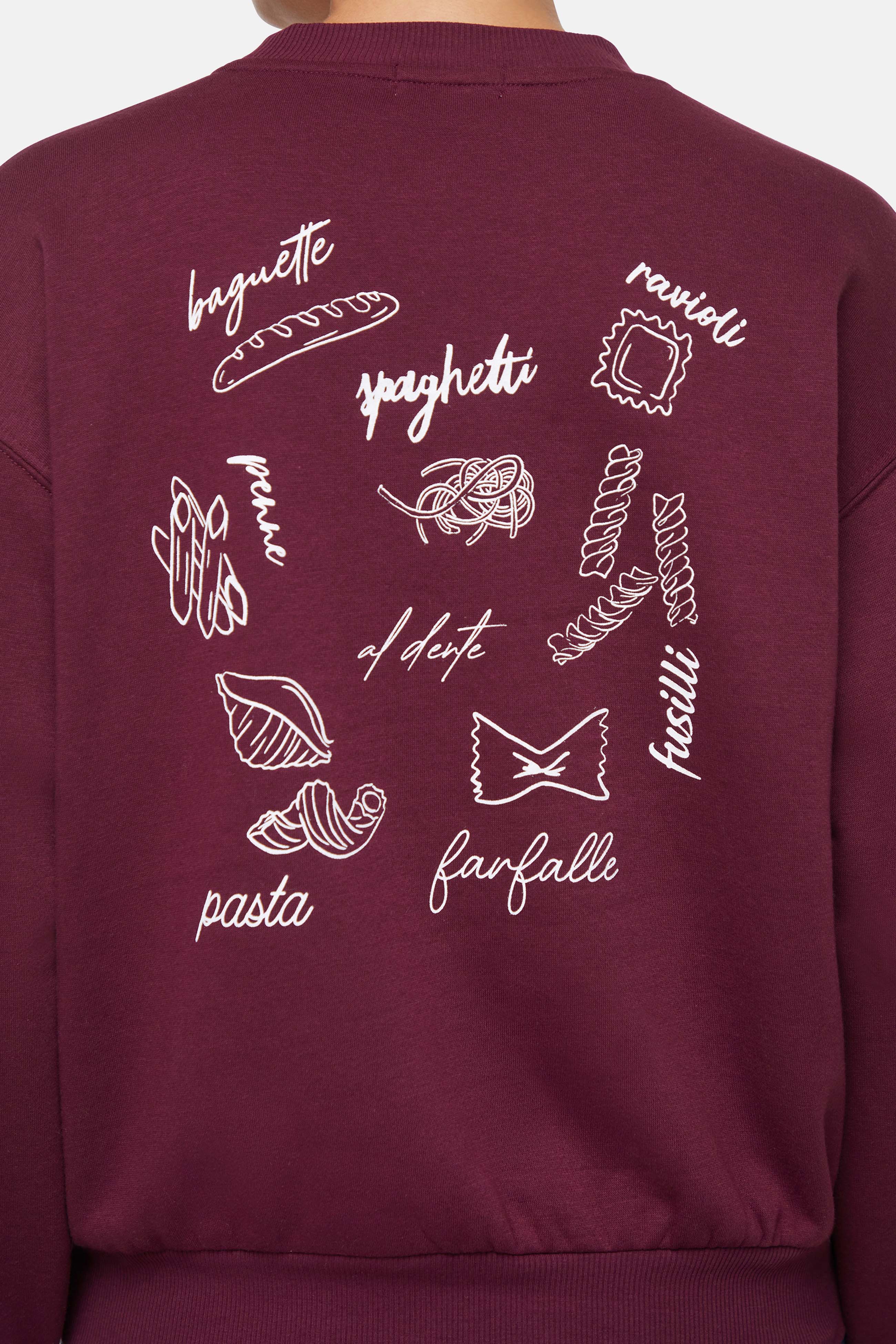 Maroon sweatshirt with white pasta illustrations and text on the back