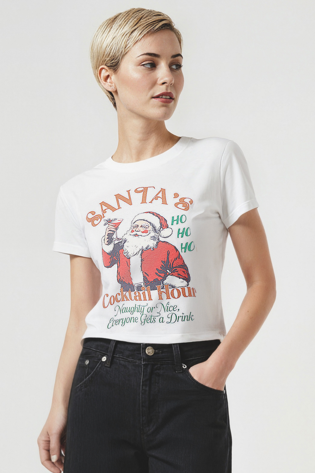 Woman wearing a white t-shirt with a Santa Claus graphic and &
