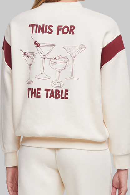 Close up of back of sweatshirt with 4 cocktails graphic and text &