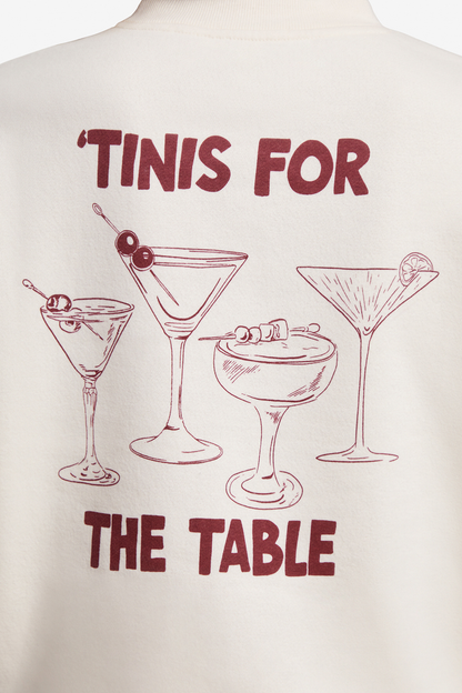 Close up of back of sweatshirt with 4 cocktails graphic and text &