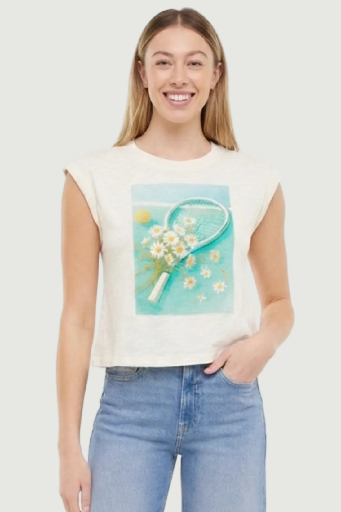 Woman wearing a white sleeveless shirt with a tennis racket and flowers design, standing against a white background.