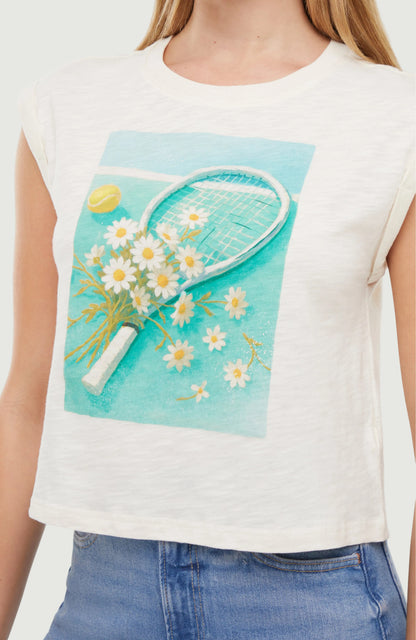 Close up of white sleeveless top with a graphic of a tennis racket and flowers on a turquoise background.