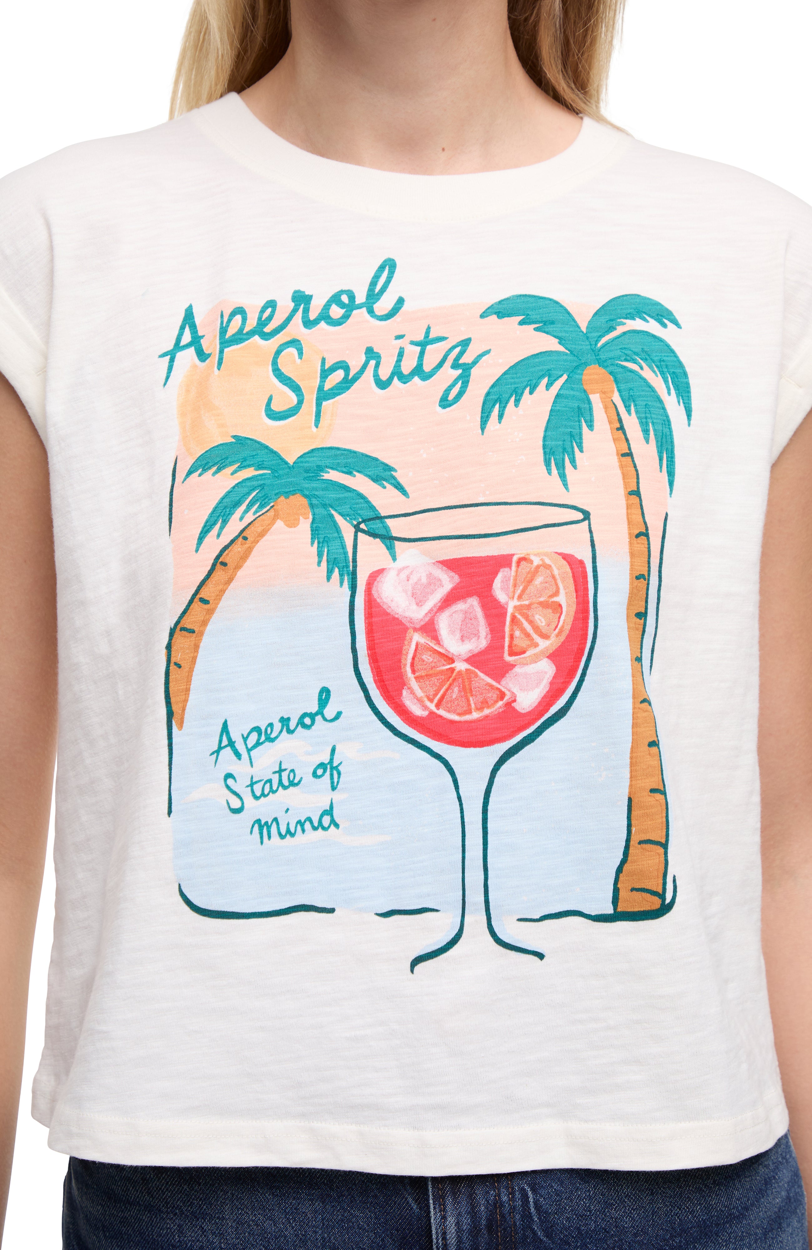 Close up view of white t-shirt with "Aperol Spritz; Aperol State of Mind" text and graphic design featuring a cocktail and palm trees  on a white background. 